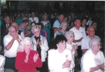The audience enjoying one of the many standing ovations. Dan's shows always bring the house down!